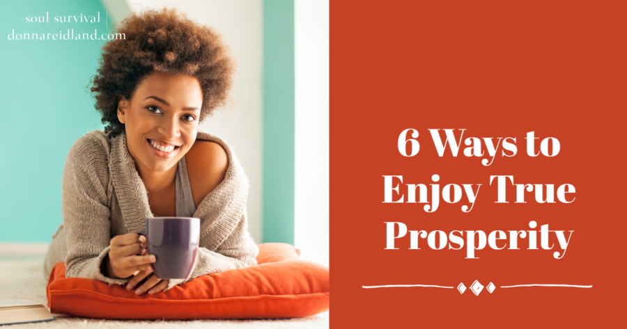 Beautiful young African American woman smiling as she relaxes at home with text that reads, 6 Ways to Enjoy True Prosperity,
