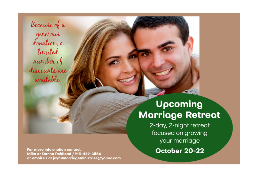 Happy couple with information about marriage retreat