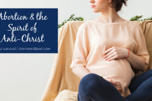 Pregnant woman in jeans and a peach colored blouse sitting cross-legged with text that reads, Abortion & the Spirit of Anti-Christ