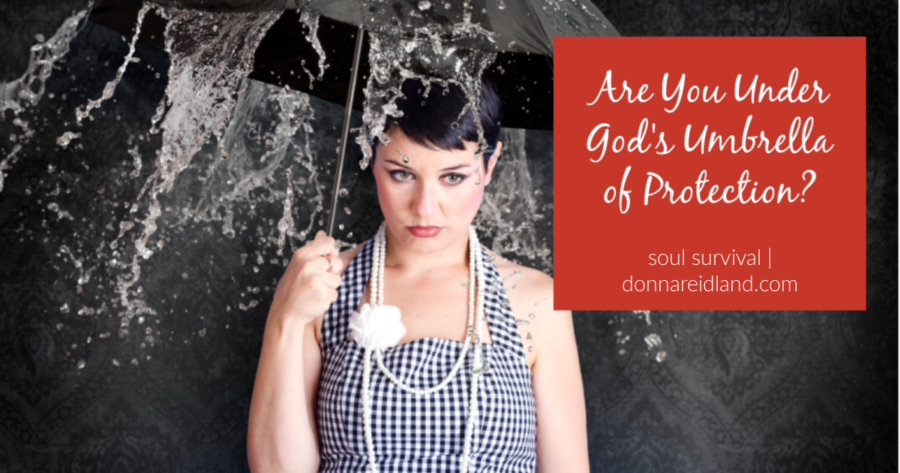 Young woman under an umbrella in the rain with text that says, are you under God's umbrella of protection?