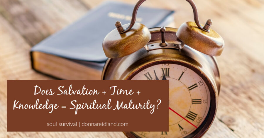 A bible and an old clock on a rough wooden background with text that reads, Does Salvation + Time + Knowledge = Spiritual Maturity?
