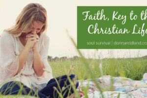 Woman sitting cross-legged outside with her head bowed in prayer with text that reads, Faith, Key to the Christian Life.