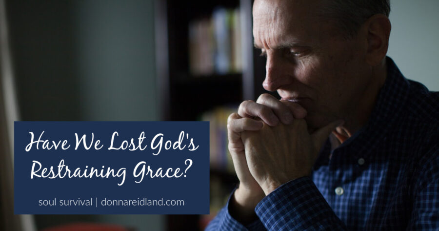 Pastor in prayer with text that reads, Have We Lost God's Restraining Grace?