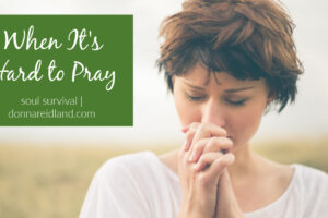 Attractive woman with short hair praying fervently with text that reads, When It's Hard to Pray