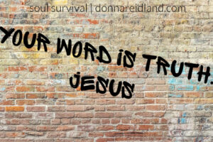 Brick wall with graffiti that says, "Your Word is Truth," Jesus.