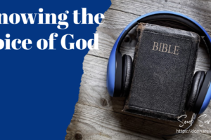 Bible with headphones around it and text that reads, Knowing the Voice of God.