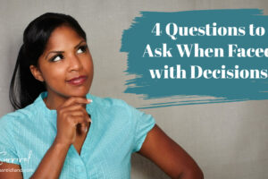 Woman with her hand on her chin looking up with a thoughtful expression, 4 Questions to Ask When Faced with Decisions