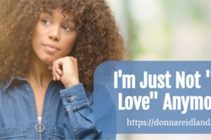 Beautiful African-American woman looking doubtful with text that reads, I'm Just Not "in Love" Anymore