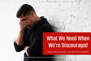 Discouraged man leaning against a wall with his hand over his face with text that reads, What We Need When We're Discouraged