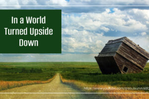 Old barn turned upside down beside a country road with text that reads, In a World Turned Upside Down