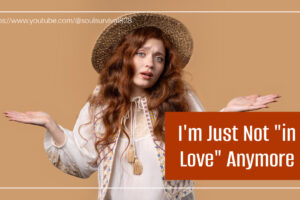 Pretty girl with long red hair and an "oh well" expression with text that reads, I'm Just Not "in Love" Anymore