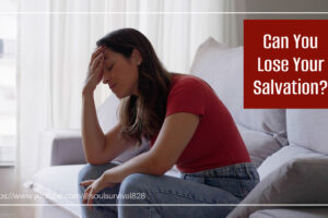 Worried woman in a red t-shirt with her hand to her forehead with text that reads, Can I Lose My Salvation?