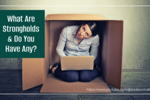 Woman hiding in a cardboard box with a laptop and text that says, What Are Strongholds & Do I Have Any?