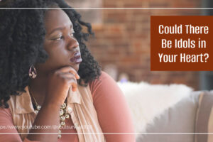 Beautiful African-American woman deep in thought with text that reads, Could There Be Idols in Your Heart?