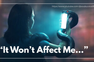 A woman holds up her phone and does not realize the attached snake.