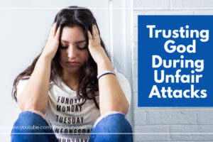 Young woman sitting on the floor with her hands on her head with text that reads: Trusting God During Unfair Attacks