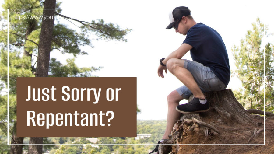 young man sitting on a boulder thinking regretfully